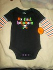 My first Halloween bodysuit with stripes sleeves Size 3-6 monthes