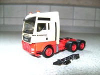 Handarbeitsmodell MAN TGX 33.480 6x4 BLS der Spedition Baumann im Maßstab 1:87