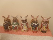 small group of figures showing rabbits in their natural habitat
