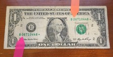 Series 2006 $1 error note: Mismatched Serial #s on Star note (0448*)