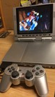 Silver PlayStation 2 Slim With Screen + Controller & 32 Meg Memory Card Bundle
