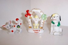 Souvenir of Bognor pixie in lucky horse shoe plus two dogs.