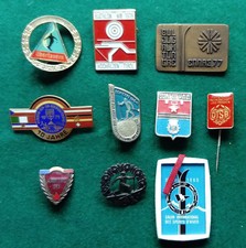 10 assorted ski, biathlon, sport and general pin badges